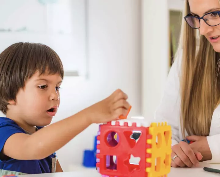A child assembling puzzle